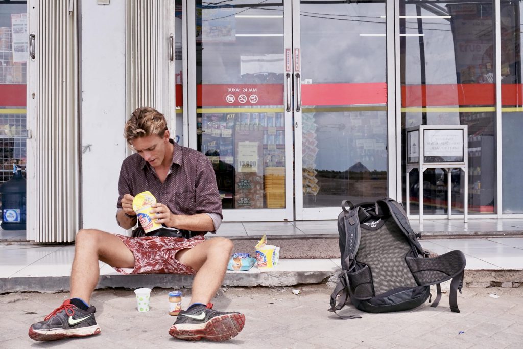 Traveller eating on floor